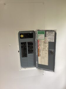 Deshaies Electrical Services inspecting and updating the electrical panel for cable replacement and permit compliance