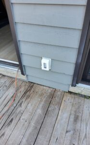 Deshaies Electrical Services installing an outdoor electrical outlet for comprehensive installation and repair services