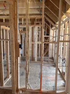 Deshaies Electrical Services installing electrical wiring in preparation for living room and basement renovations