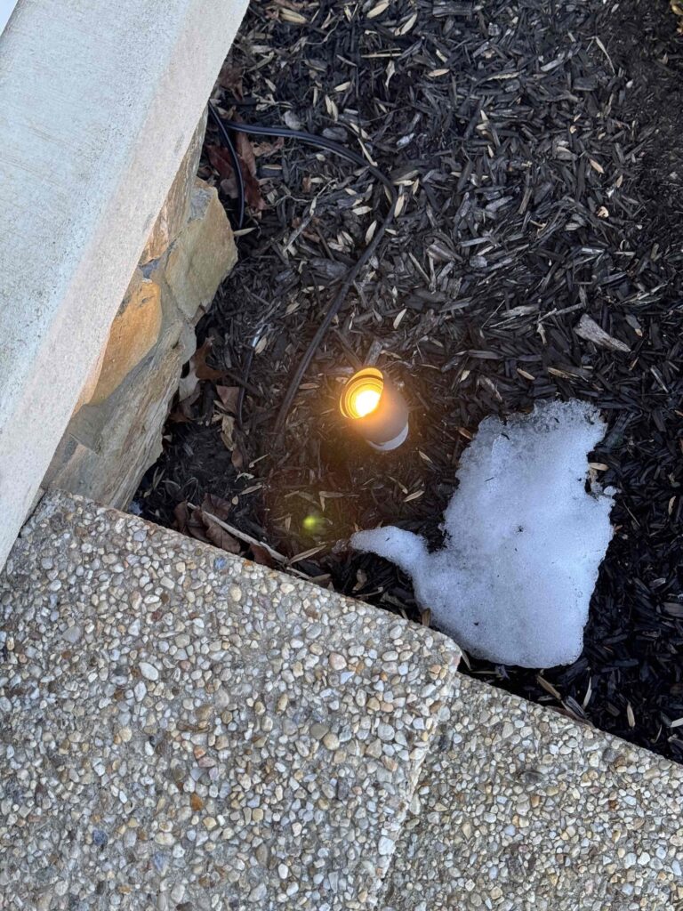 Deshaies Electrical Services repairing dusk to dawn landscape lighting for improved outdoor visibility