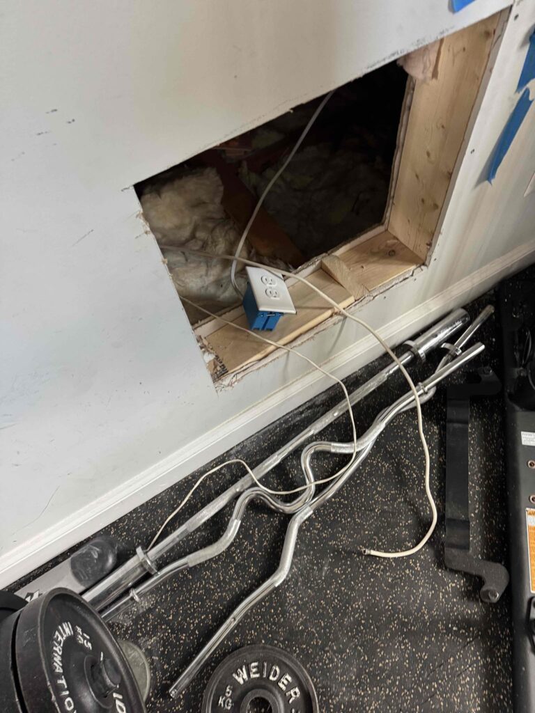 Electrical work related to reconfiguring outlets for built-in cabinets, ensuring proper installation and access