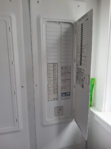 Deshaies Electrical Services inspecting circuit breakers for troubleshooting and replacement