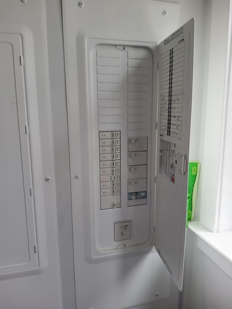 Deshaies Electrical Services inspecting circuit breakers for troubleshooting and replacement