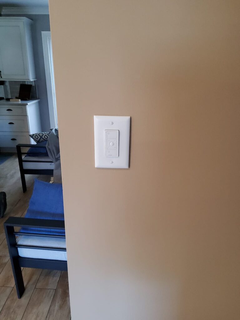 Deshaies Electrical Services installing a new light switch for the living room lighting upgrade project