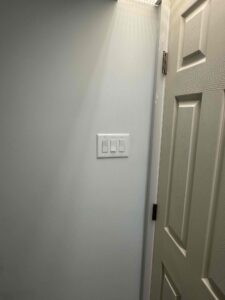 Deshaies Electrical Services installing and testing light switches for a comprehensive electrical installation project