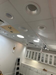 Deshaies Electrical Services installing recessed lighting as part of an electrical upgrade and ceiling restoration project