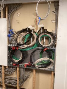 Deshaies Electrical Services organizing wiring for a lighting display installation project