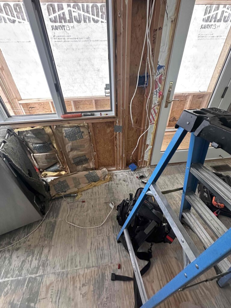 Deshaies Electrical Services preparing wiring for recessed lighting installation after wall demolition