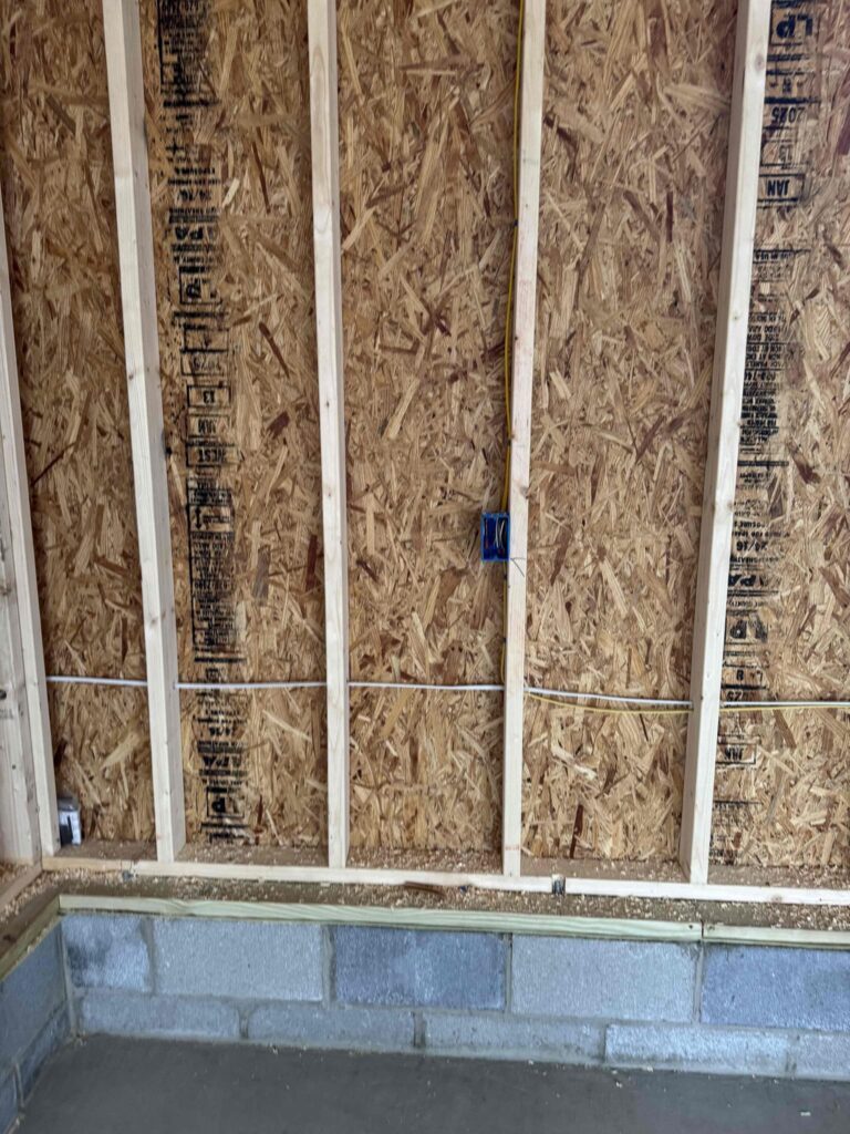 Deshaies Electrical Services running electrical wiring for garage panel installation