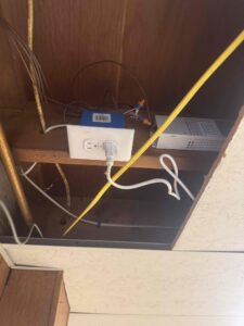 Electrical technicians performing wiring installation and modifications for a comprehensive electrical system upgrade