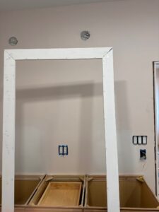 Electrical technicians preparing to install outlets and light fixtures for the Riggs residence project