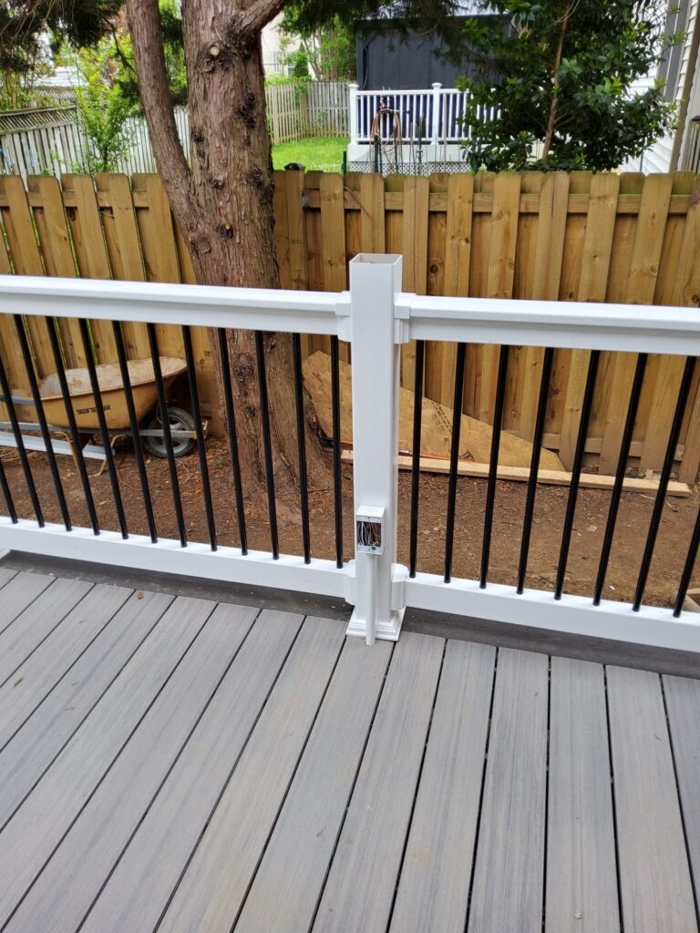 Deshaies Electrical Services installing an exterior receptacle on a deck for an electrical retrofit project