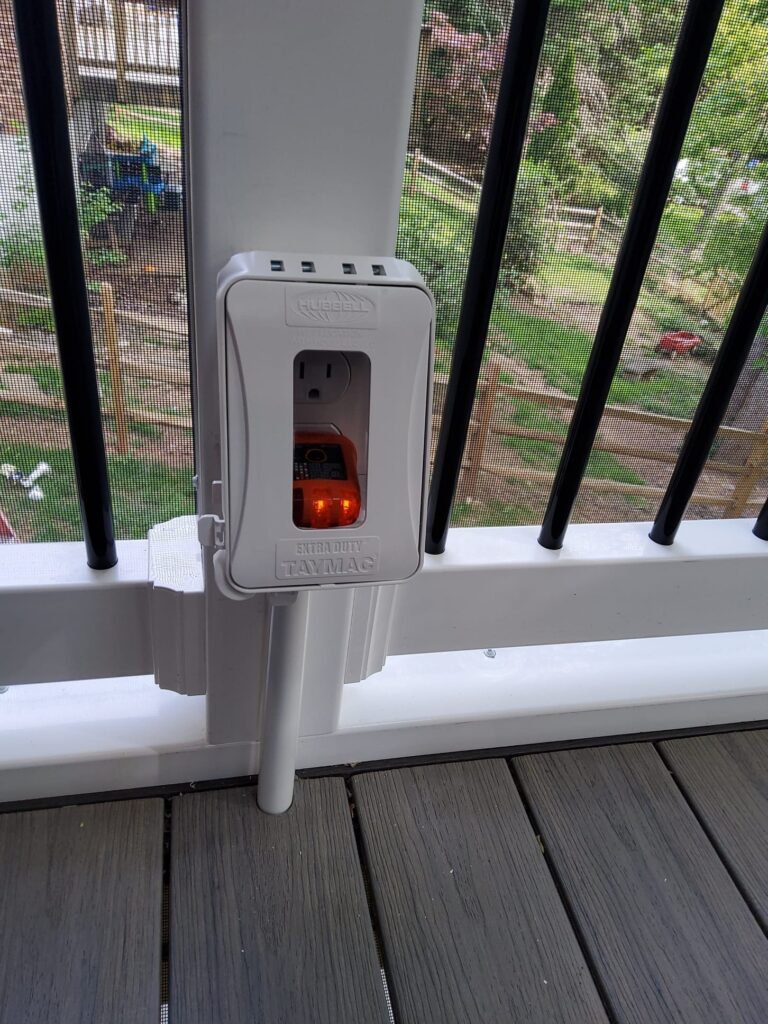 Deshaies Electrical Services installing an outdoor electrical outlet for enhanced functionality and safety in outdoor spaces